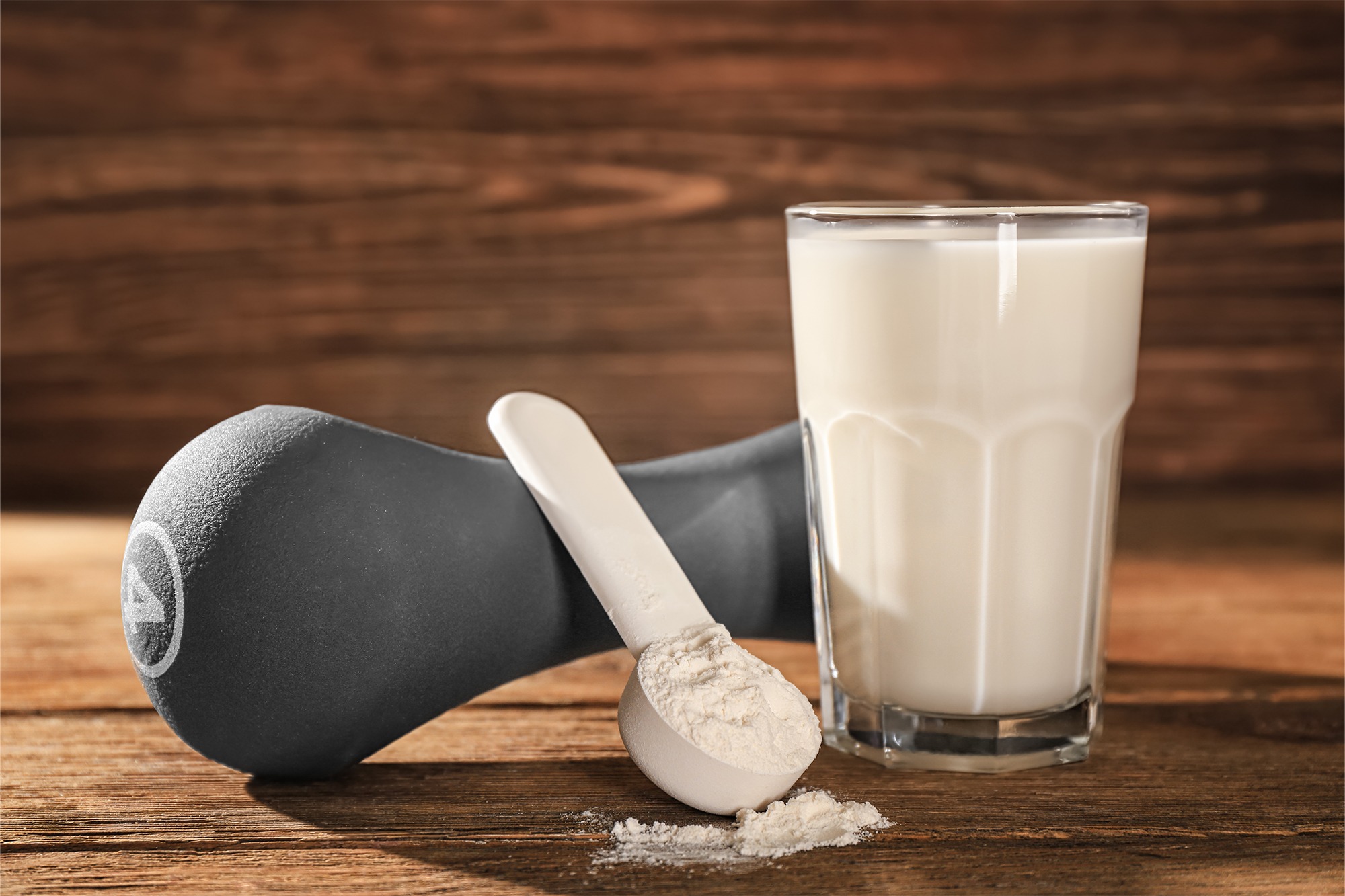 Nutrition shake with protein powder and a dumbbell